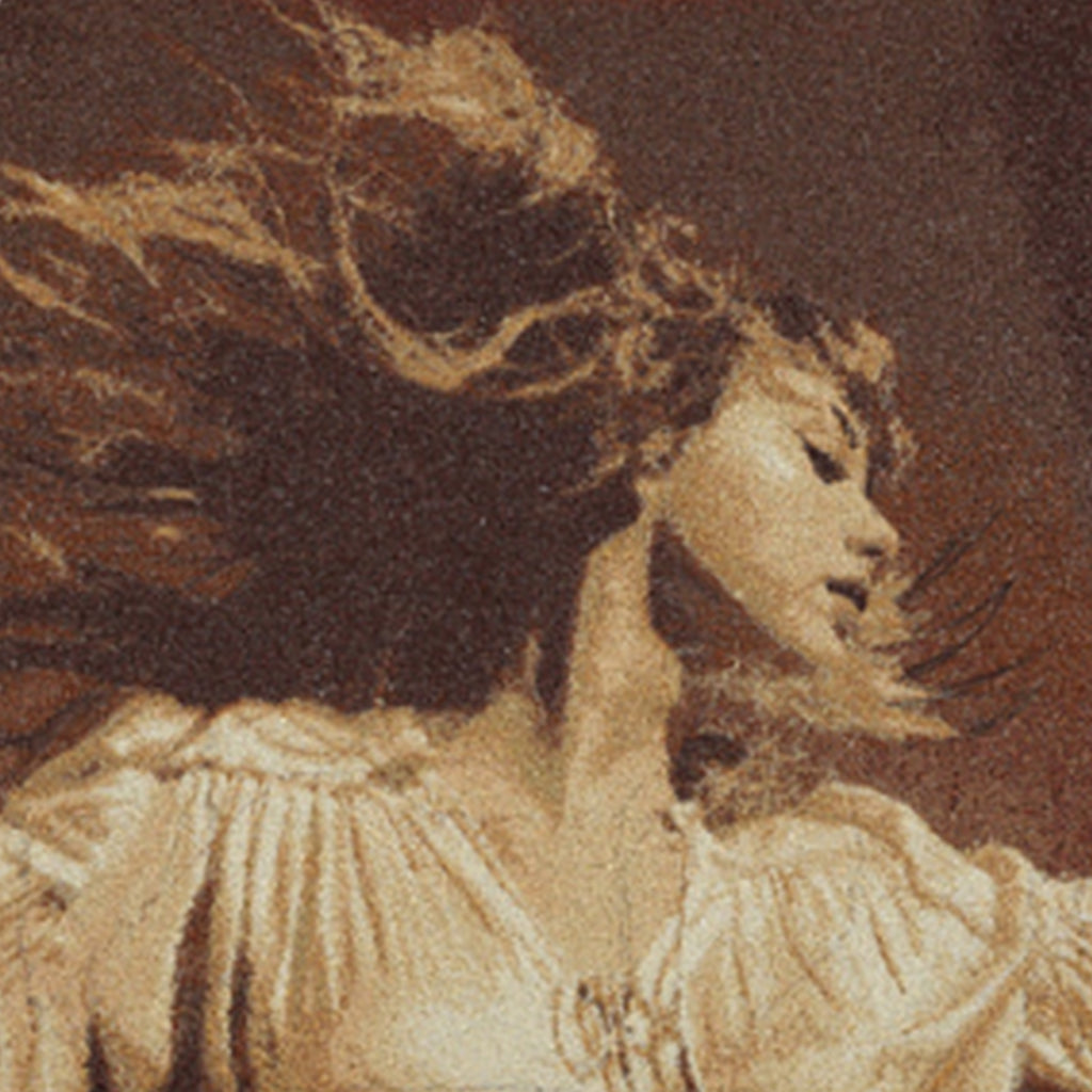 Close-up of a textured fabric with a pattern resembling a woman's face and hair.
