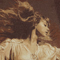 Close-up of a textured fabric with a pattern resembling a woman's face and hair.
