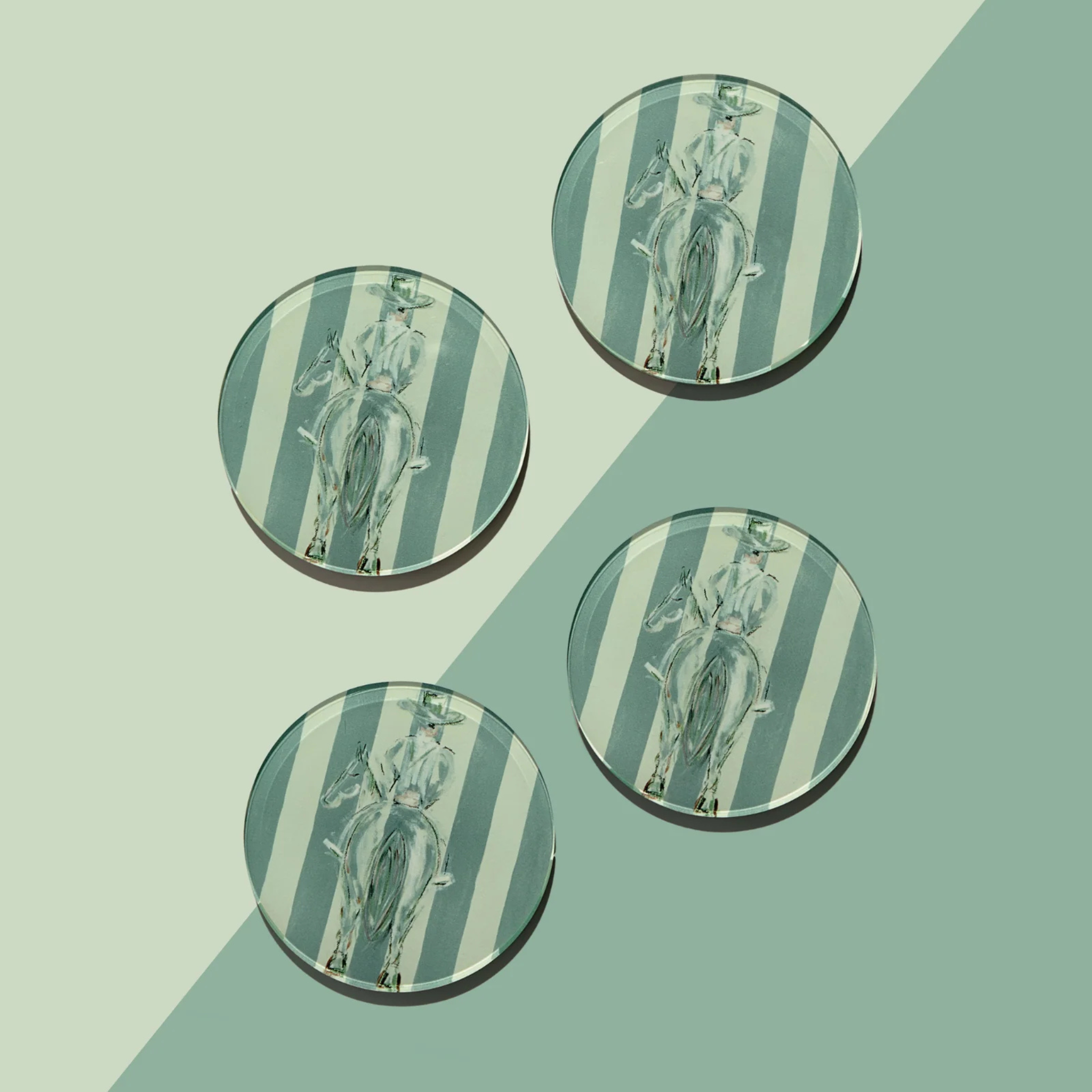 Four circular coasters with striped and western design on a green background