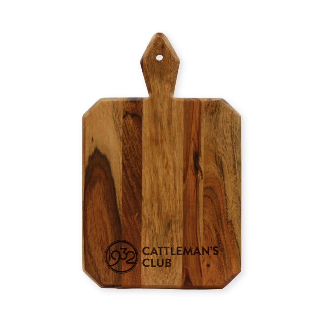 Wooden cutting board with 'Cattleman's Club' logo and text on a white background