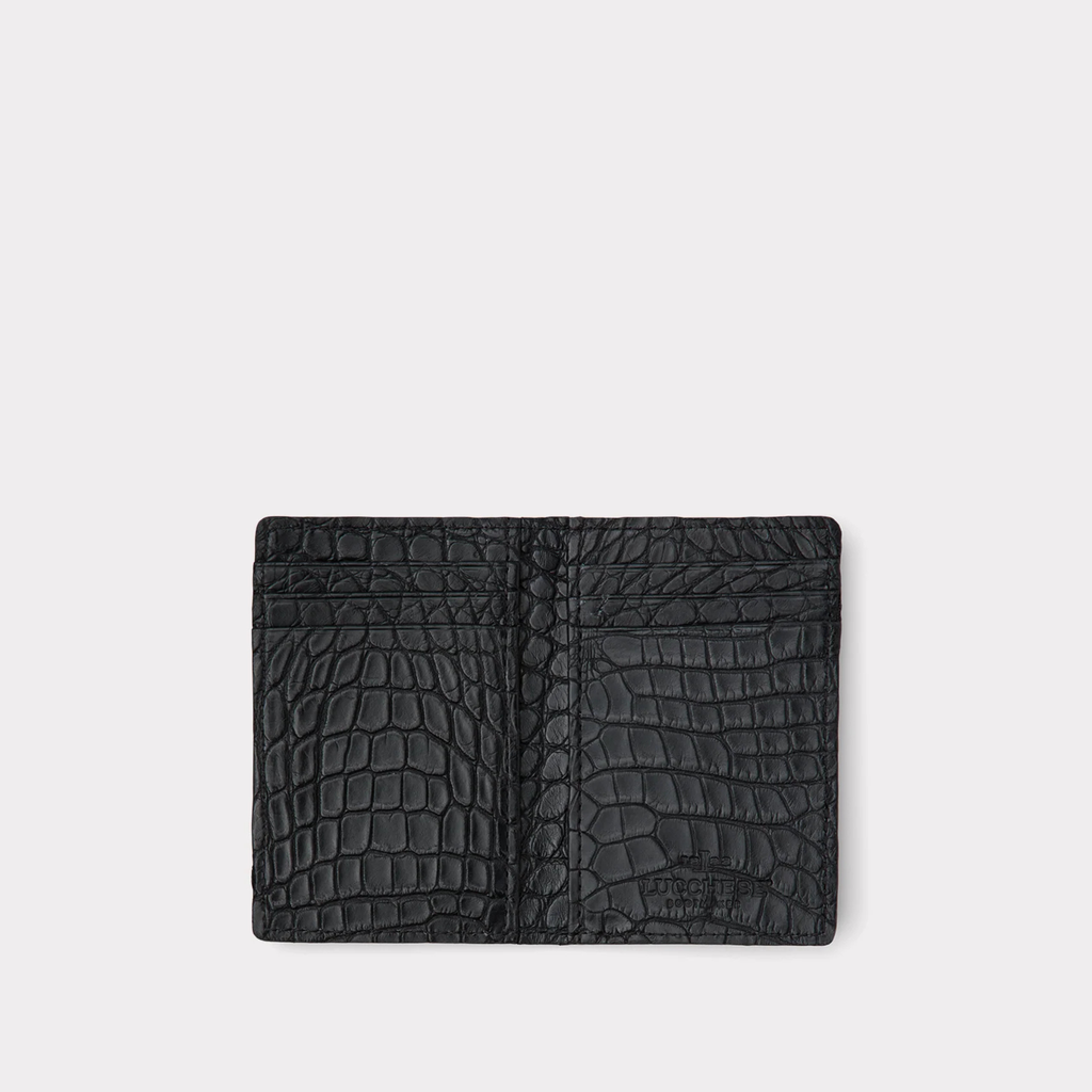 Black crocodile-patterned with 6 card slots wallet on a light gray background