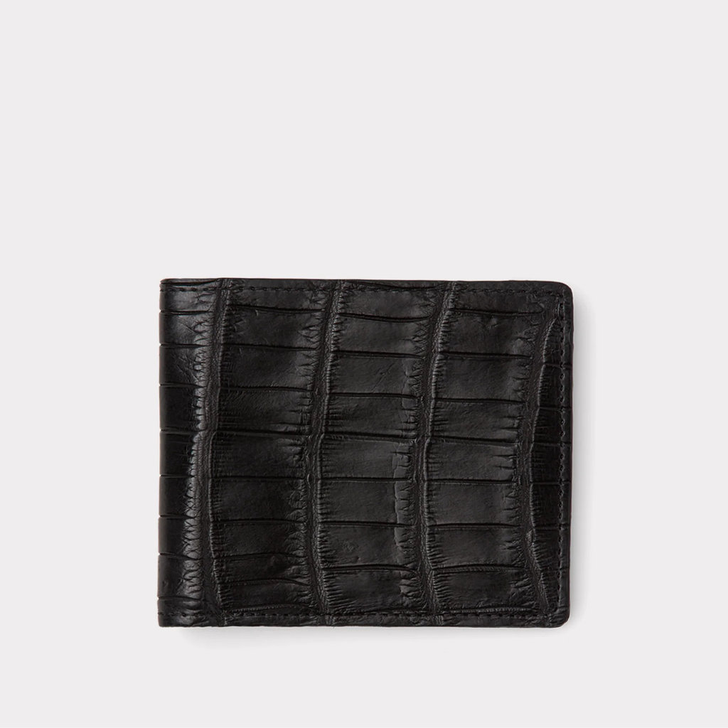 Black leather wallet with crocodile texture on a light gray background