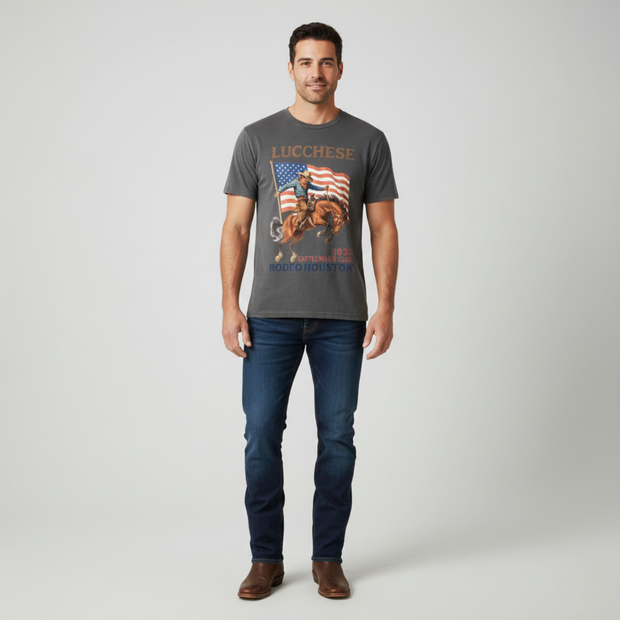 Man wearing a gray t-shirt with a graphic design on a plain background