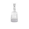 Clear glass decanter with silver stopper on a white background