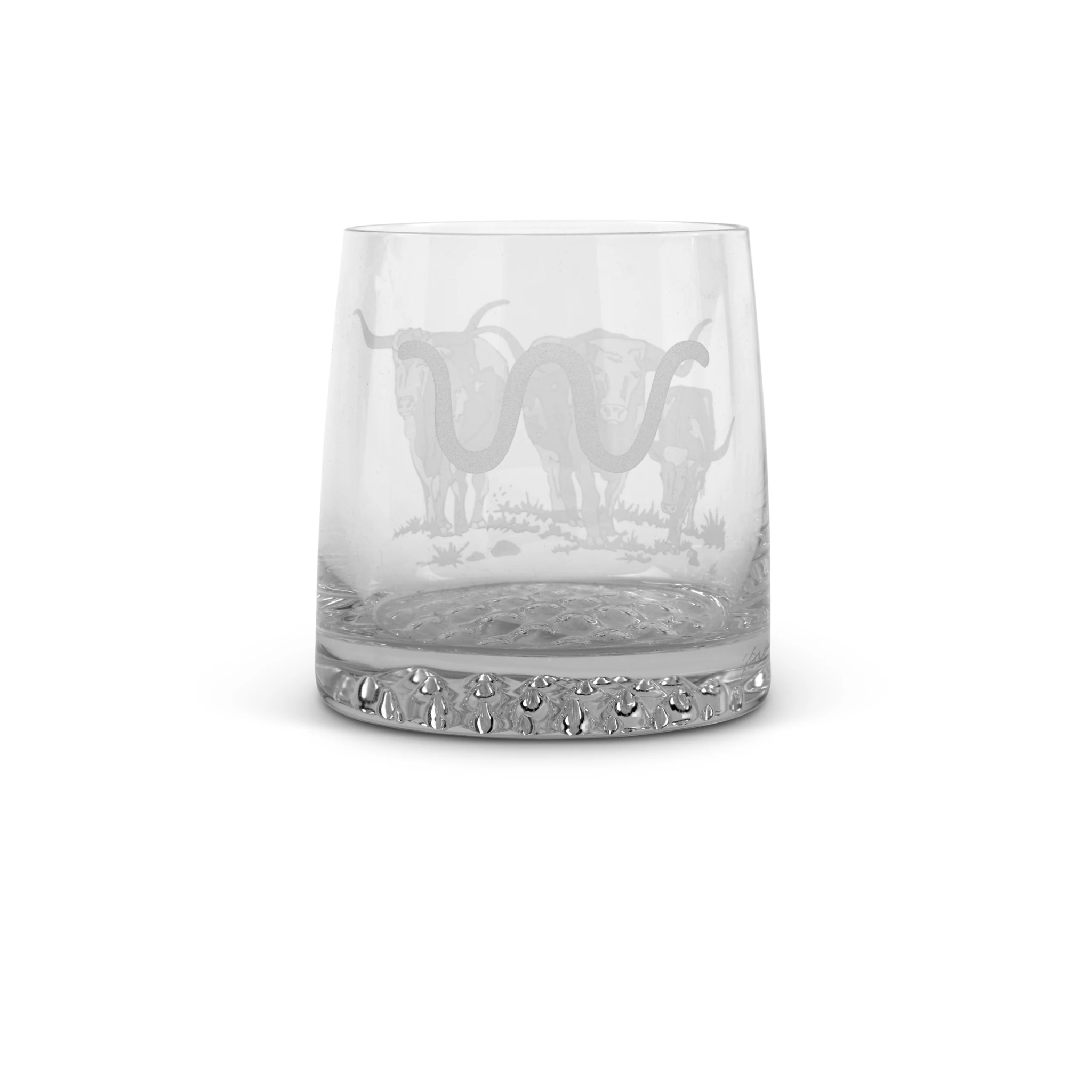 Clear whisky glass with King Ranch logo engraved  on a white background