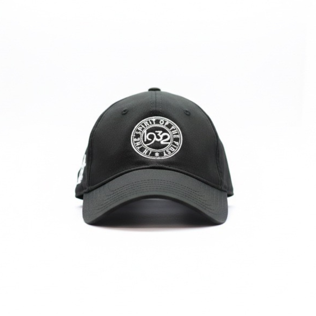 Front view of a Black cap with a 1932 Cattleman's Club logo on a white background