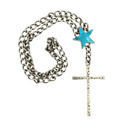 A silver chain necklace featuring a large turquoise star accent and a long silver cross pendant engraved with small stars and crescent moon shapes.
