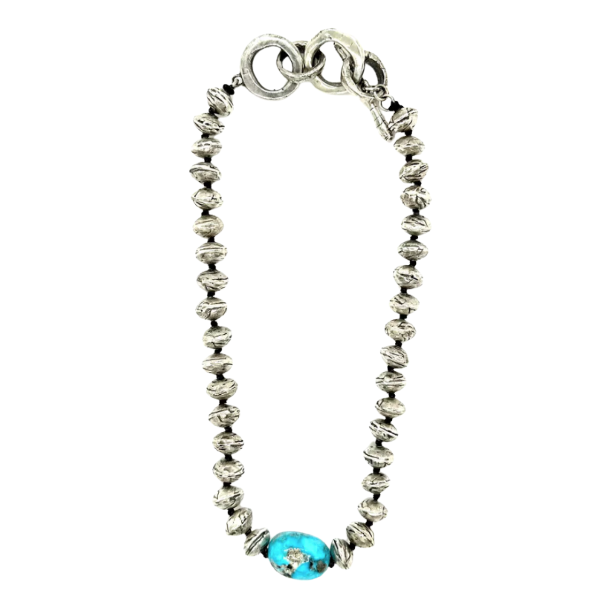 A silver beaded necklace featuring a series of ridged, oval-shaped metal beads and a single large turquoise stone at the center, finished with oversized interlocking silver rings as the clasp.