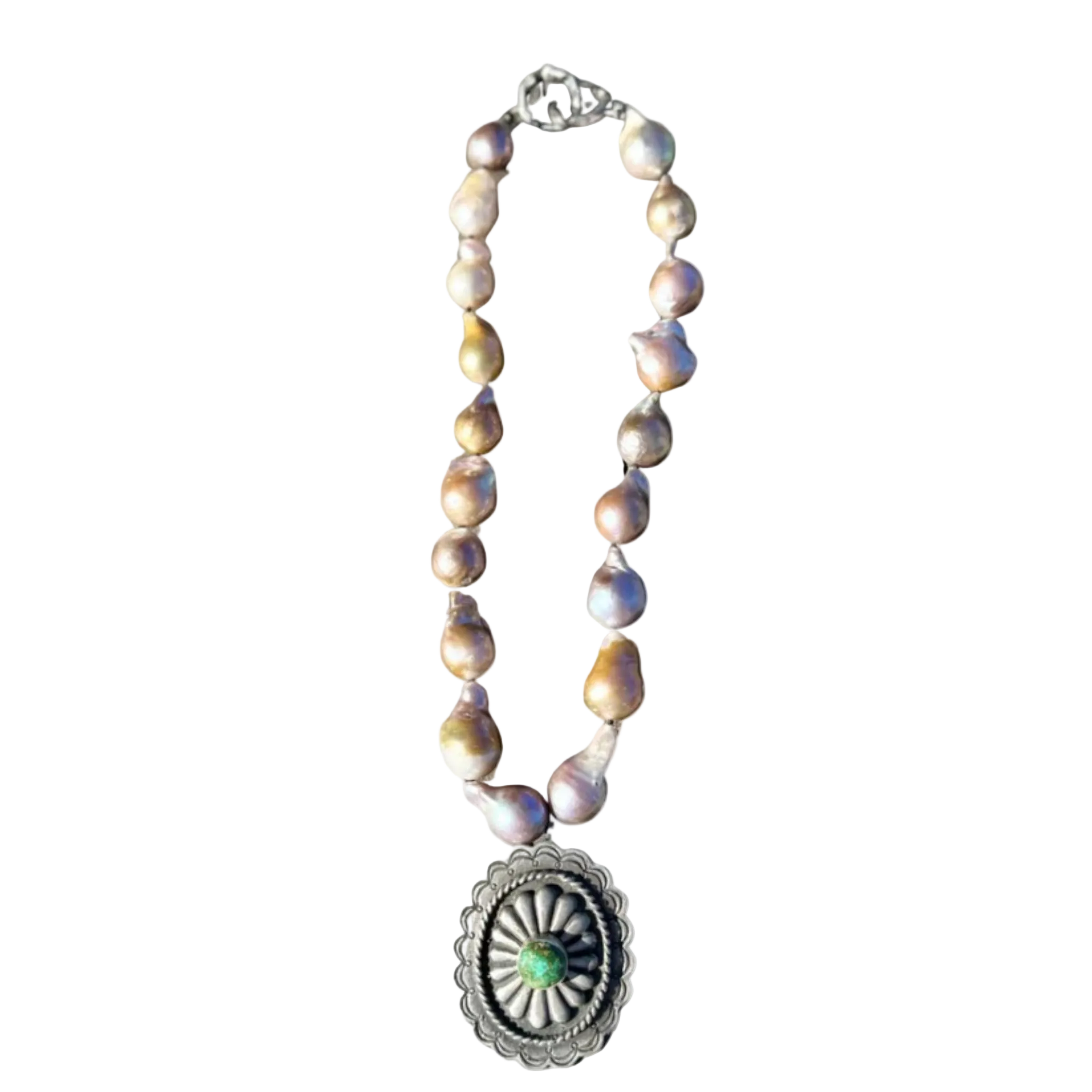 A necklace made of large, irregularly shaped baroque pearls in soft iridescent tones, featuring a large silver pendant with a scalloped design and a central green stone.